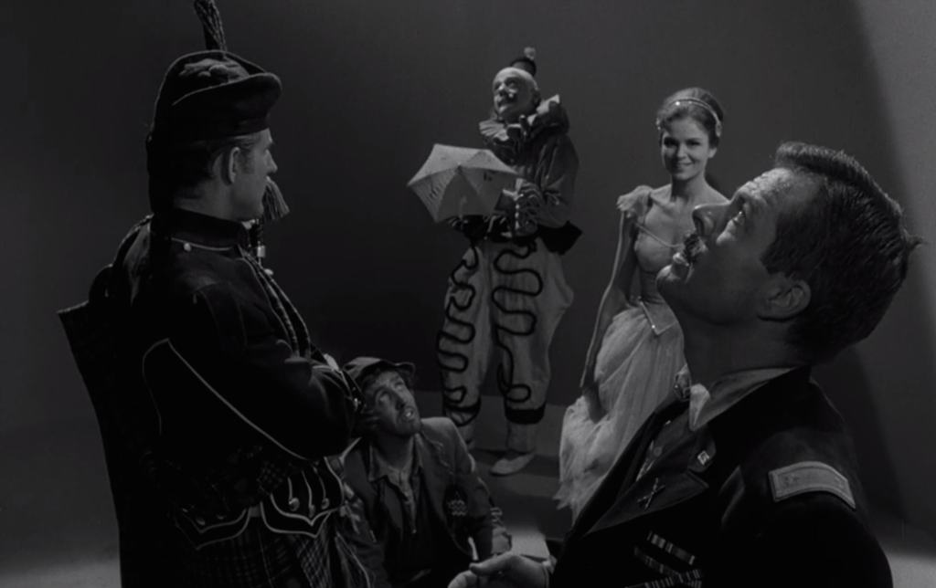A hobo, ballerina, clown bagpipe player and major in search of an exit.
